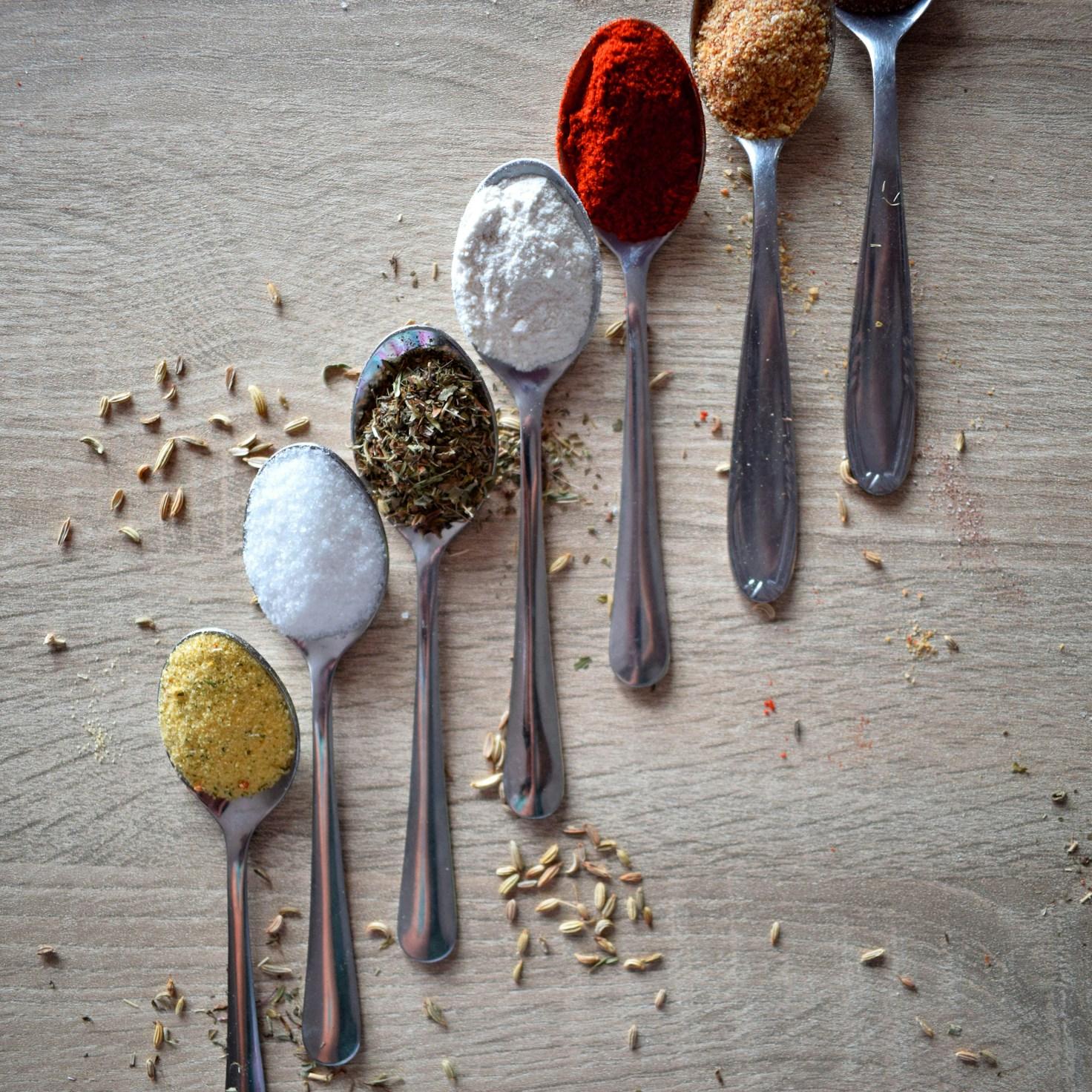 Community members collaborating in a contemporary kitchen, sharing recipes and techniques